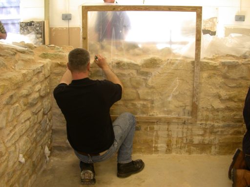 tracing stones on plastic sheeting during conservation training