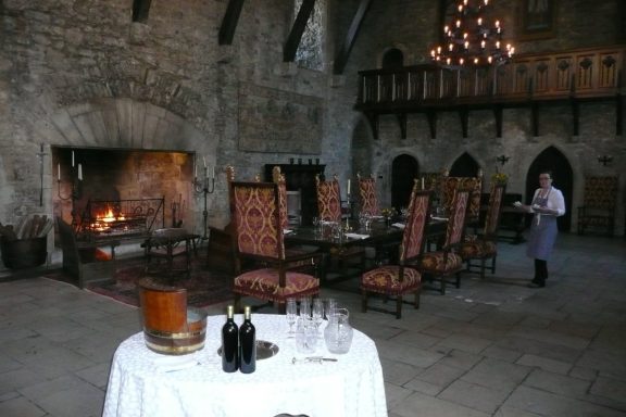 a grand table setting with a fireplace in the background