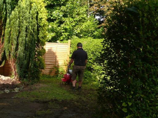 Craig preparing the lawns to seed at the Gatehouse