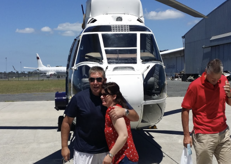 Kirsten and a helicopter pilot in front of a puma helicopter in South Africa